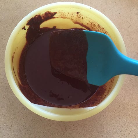 Fudge chocolate on a fork and molded chocolate squares and stars