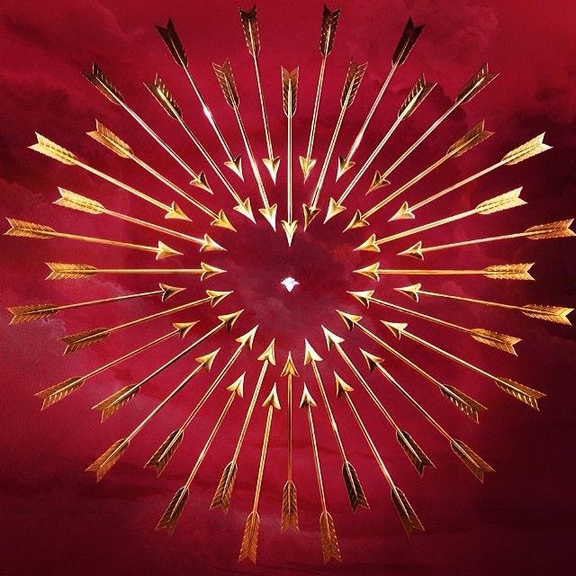 This may contain: a red background with gold arrows in the shape of a starburst on it