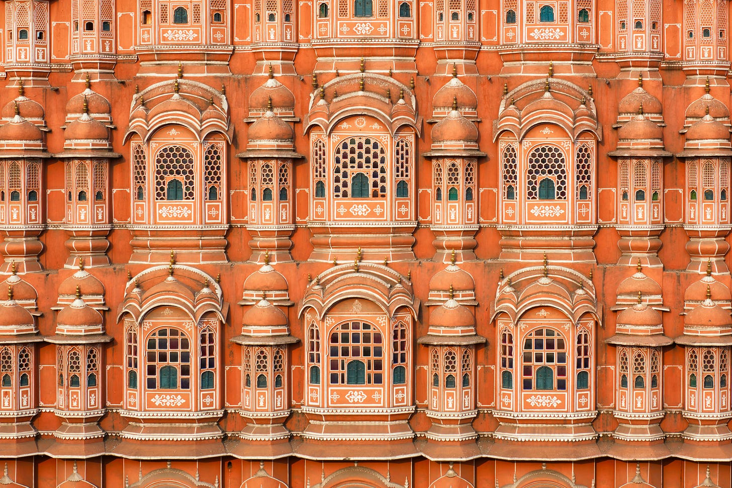 An orange palace or building with ornate windows