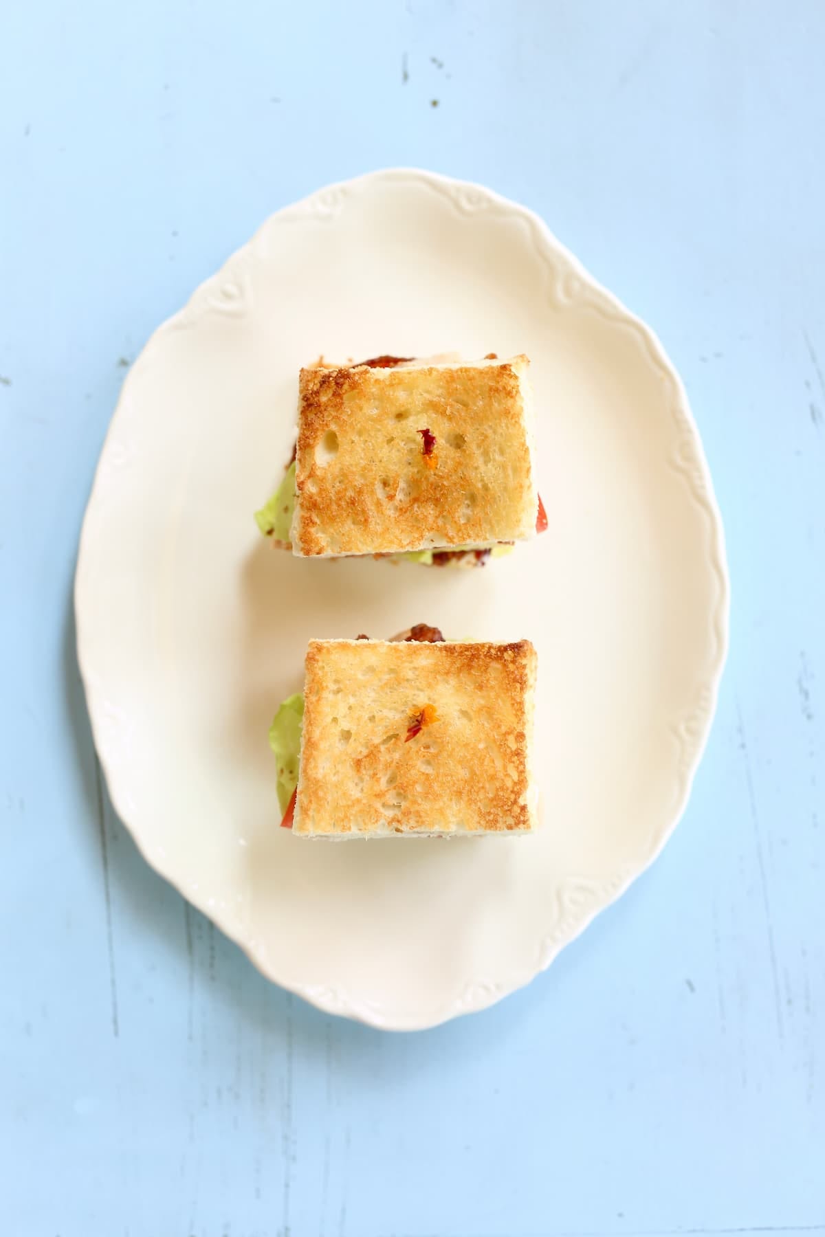 an overhead photo of two small club sandwiches.