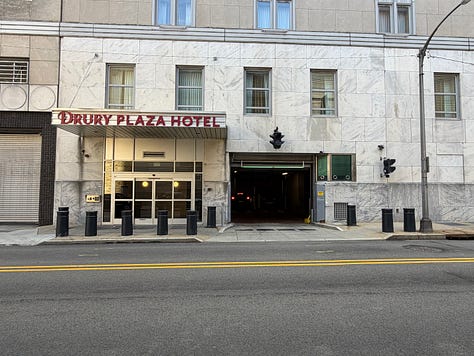 buildings, sky, sign, street, sidewalk