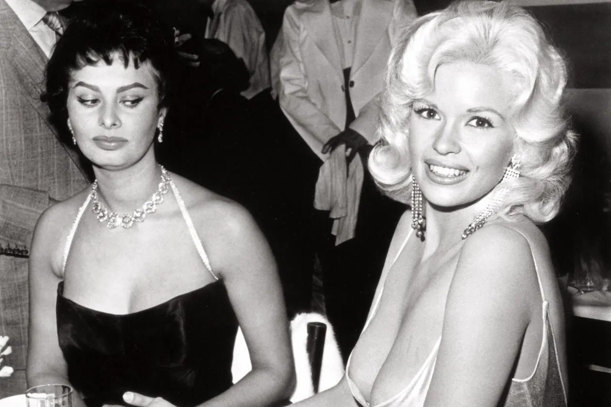 Sophia Loren side-eyes Jayne Mansfield. Sophia Loren side-eyes Jayne Mansfield.