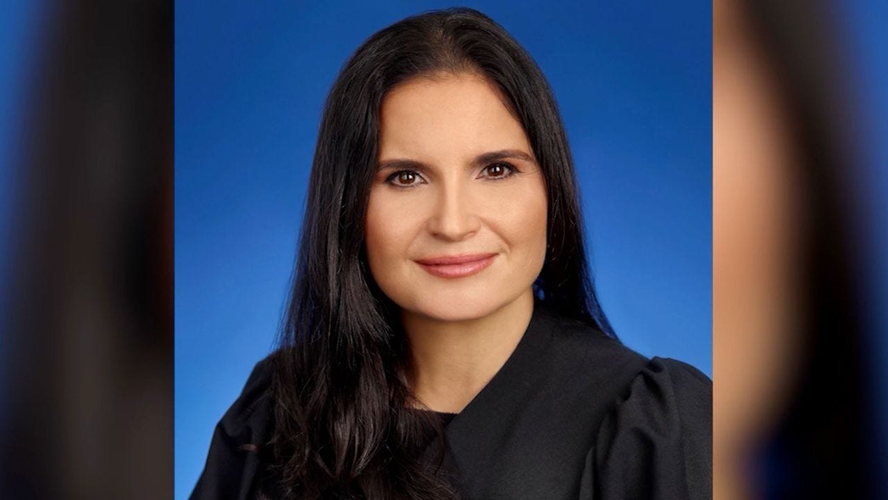 A person in a black robe

AI-generated content may be incorrect.