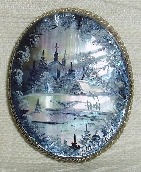Antique mother of pearl handpainted Russian brooches.