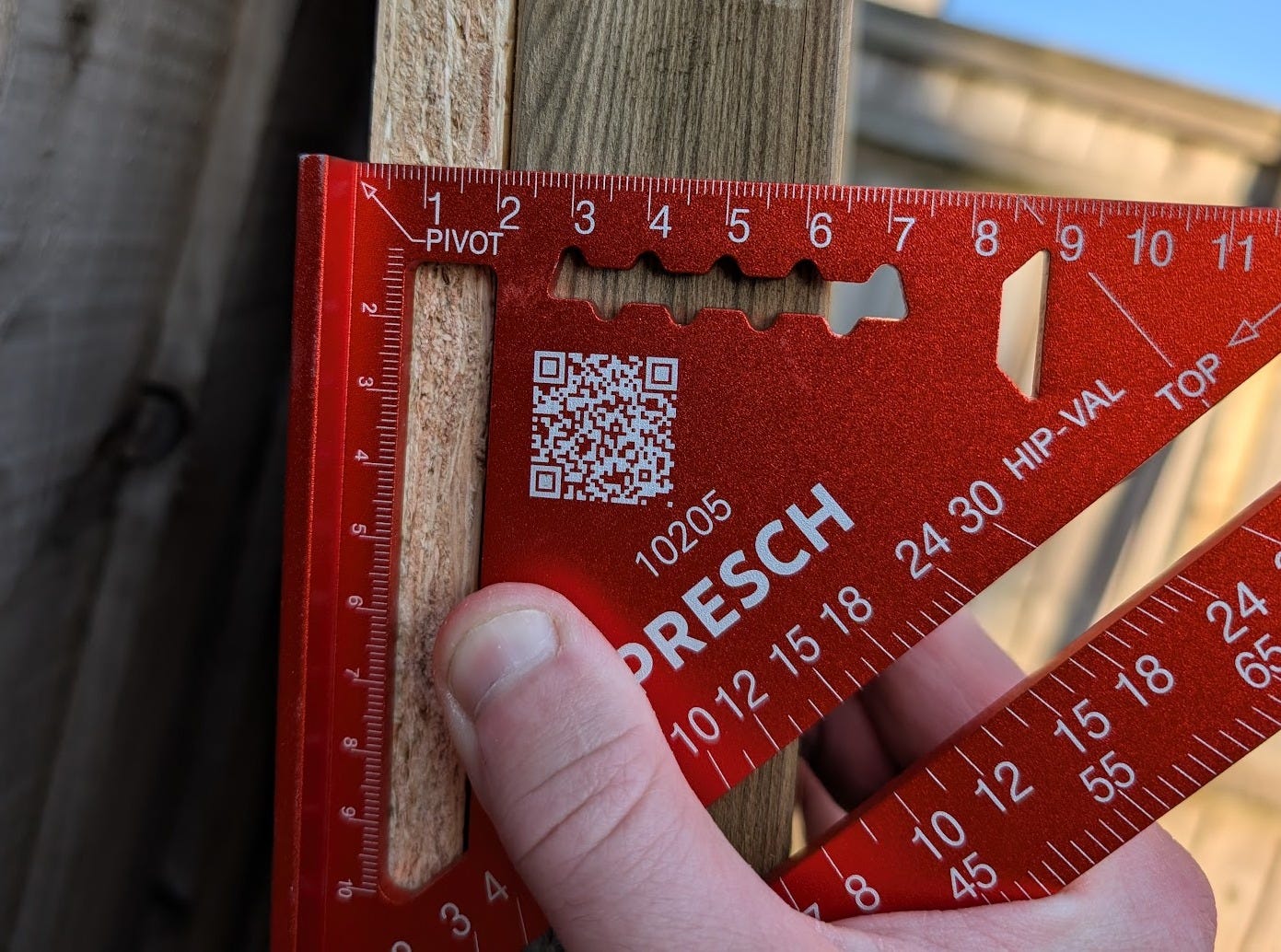 Measuring 35mm cladding overhang on shed wall frame