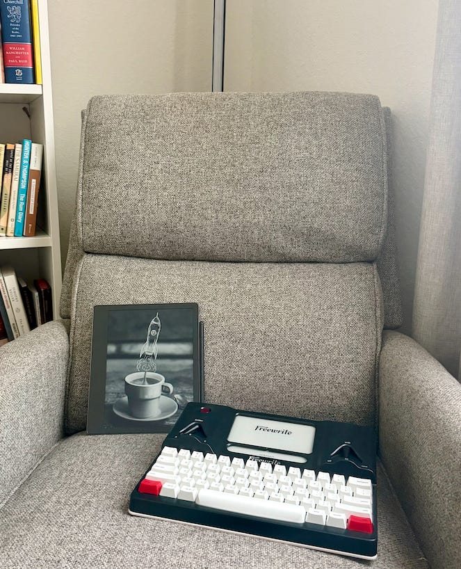 Kindle Scribe and Freewrite typewriter on a couch