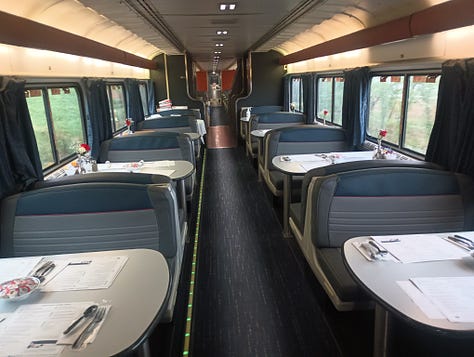 Bunn coffee maker, looking down the dining car on one train, looking down another dining car, the menu, chicken dinner on the train
