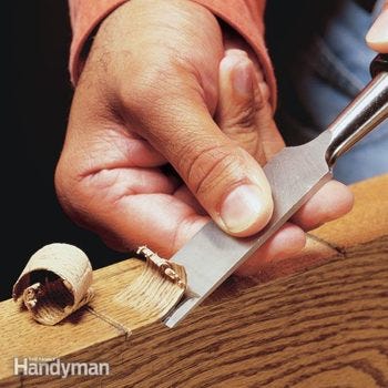 Chisel & curl of wood.