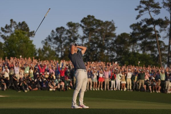 Rory McIlroy, of Northern Ireland, reacts after winning in a playoff against Justin Rose after the final round at the Masters golf tournament, Sunday, April 13, 2025, in Augusta, Ga. (AP Photo/Matt Slocum)