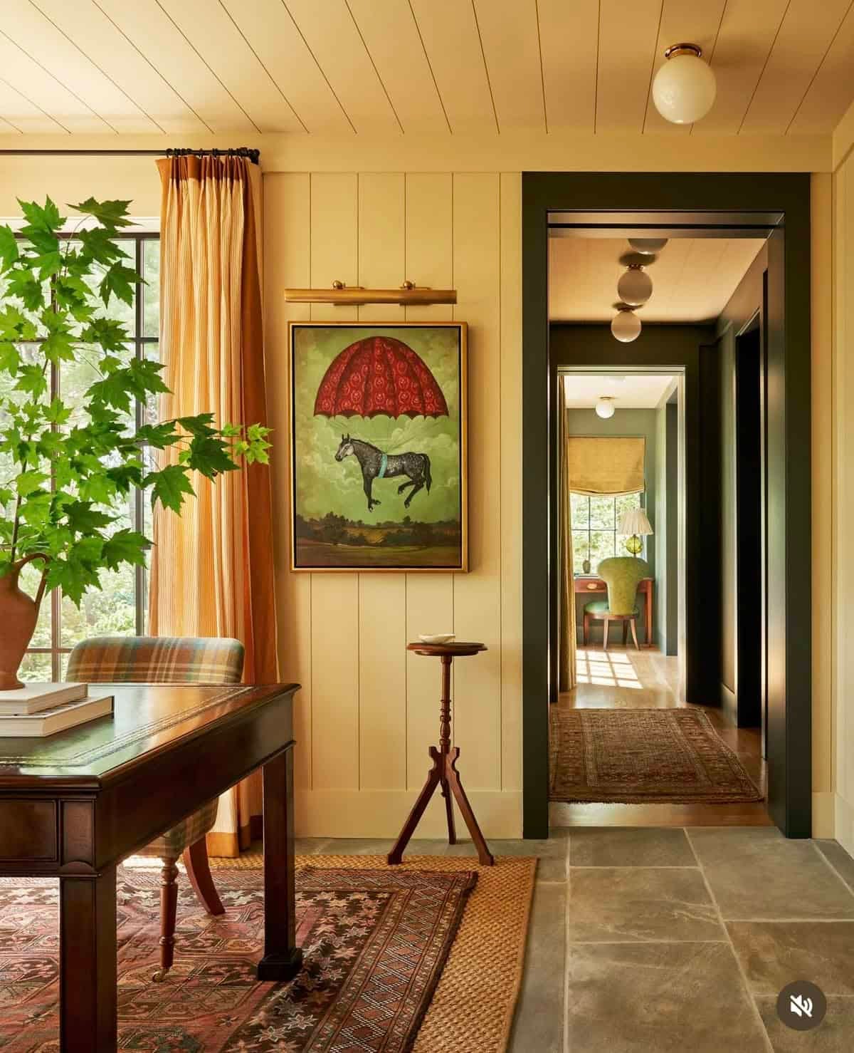 a warm yellow, warm with green doorway trim featuring. vintage rug, oak table, and bright green potted plant. a warm yellow, warm with green doorway trim featuring. vintage rug, oak table, and bright green potted plant.