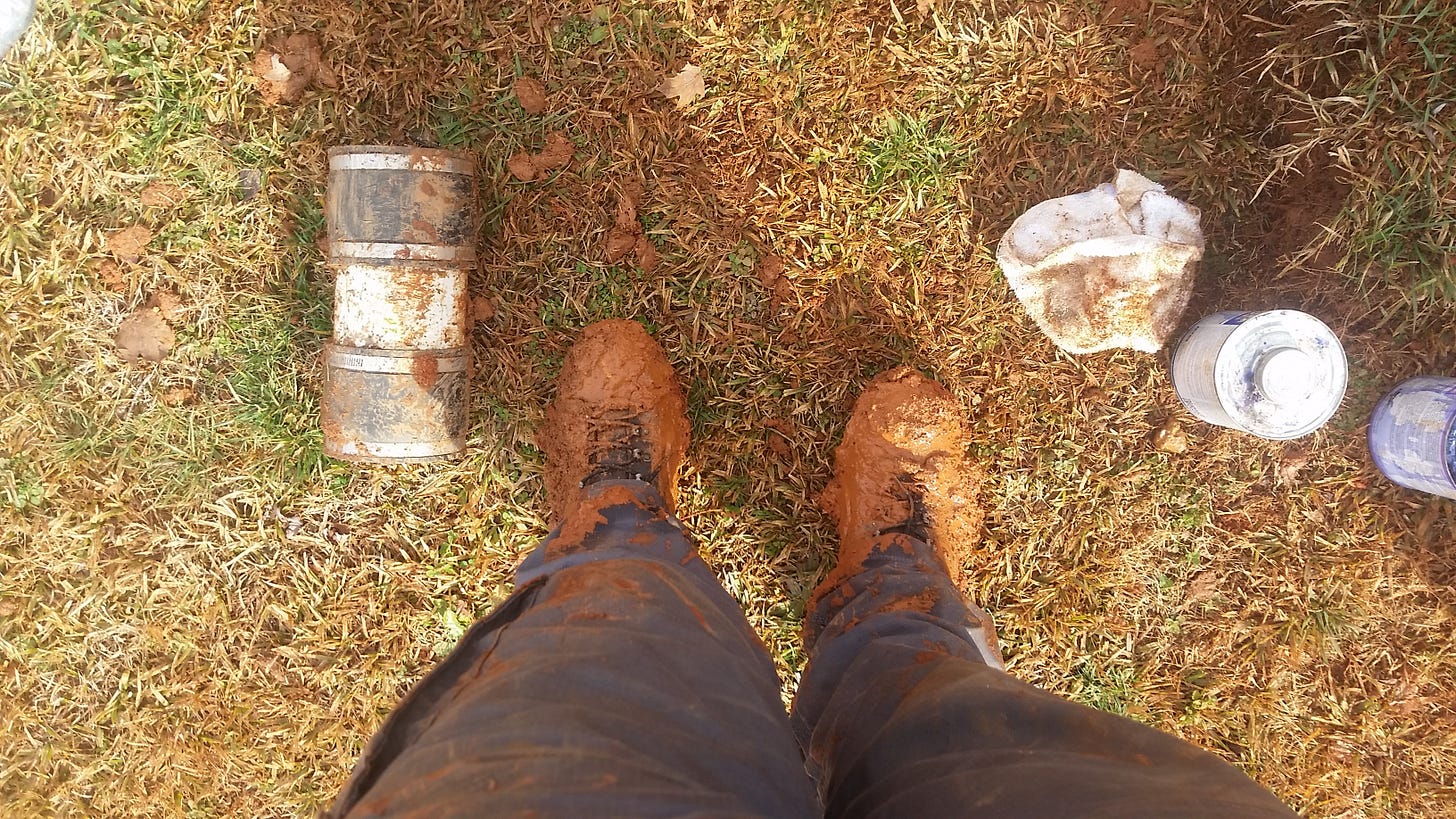 Service plumbers muddy boots from a day working in the field as an owner.