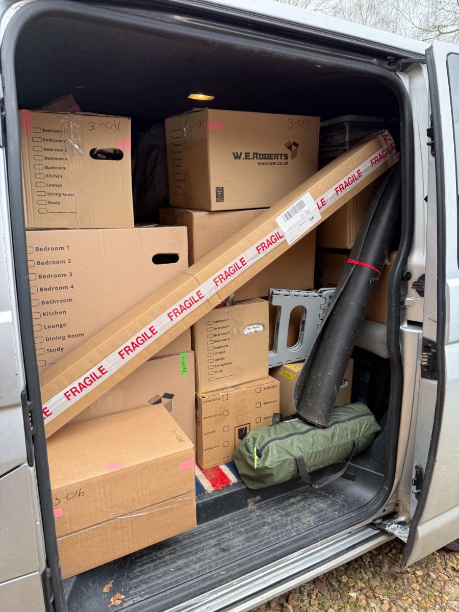 A photo of my van filled with packed boxes.