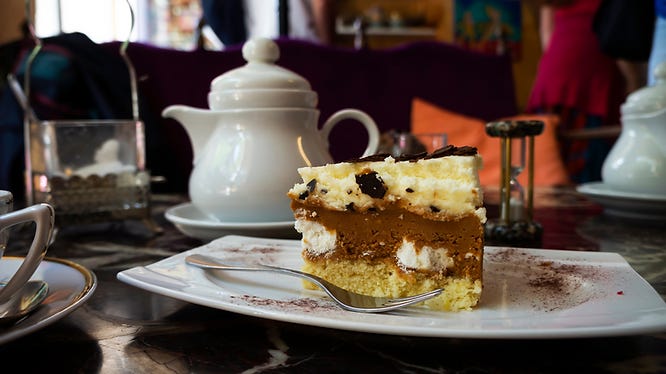 homemade cake and a pot of tea await enjoyment in a local teashop