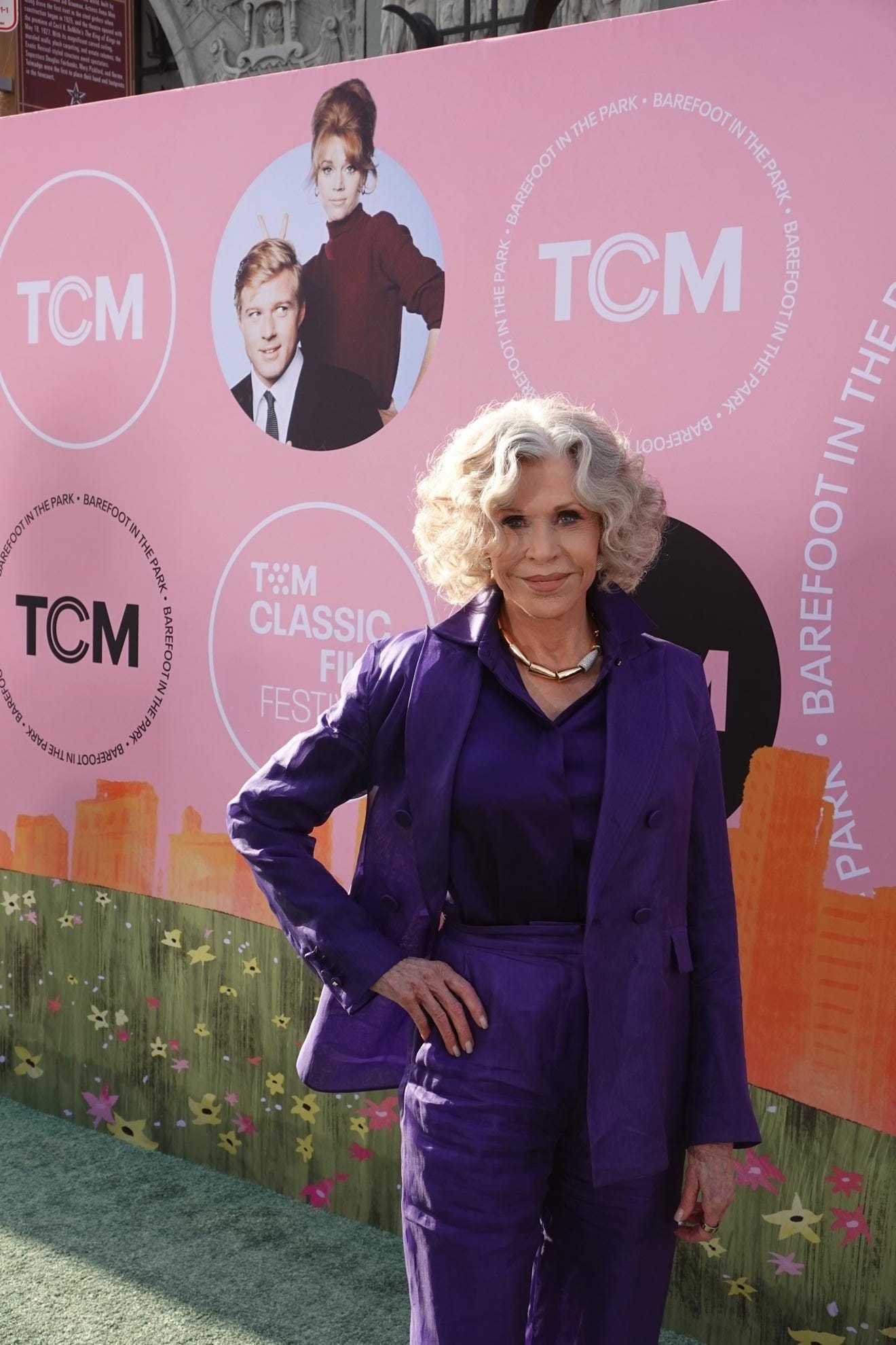 A person in a purple coat

AI-generated content may be incorrect.