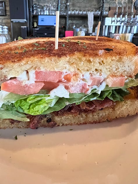 a bacon lettuce and tomatoe sandwich on sourdough bread