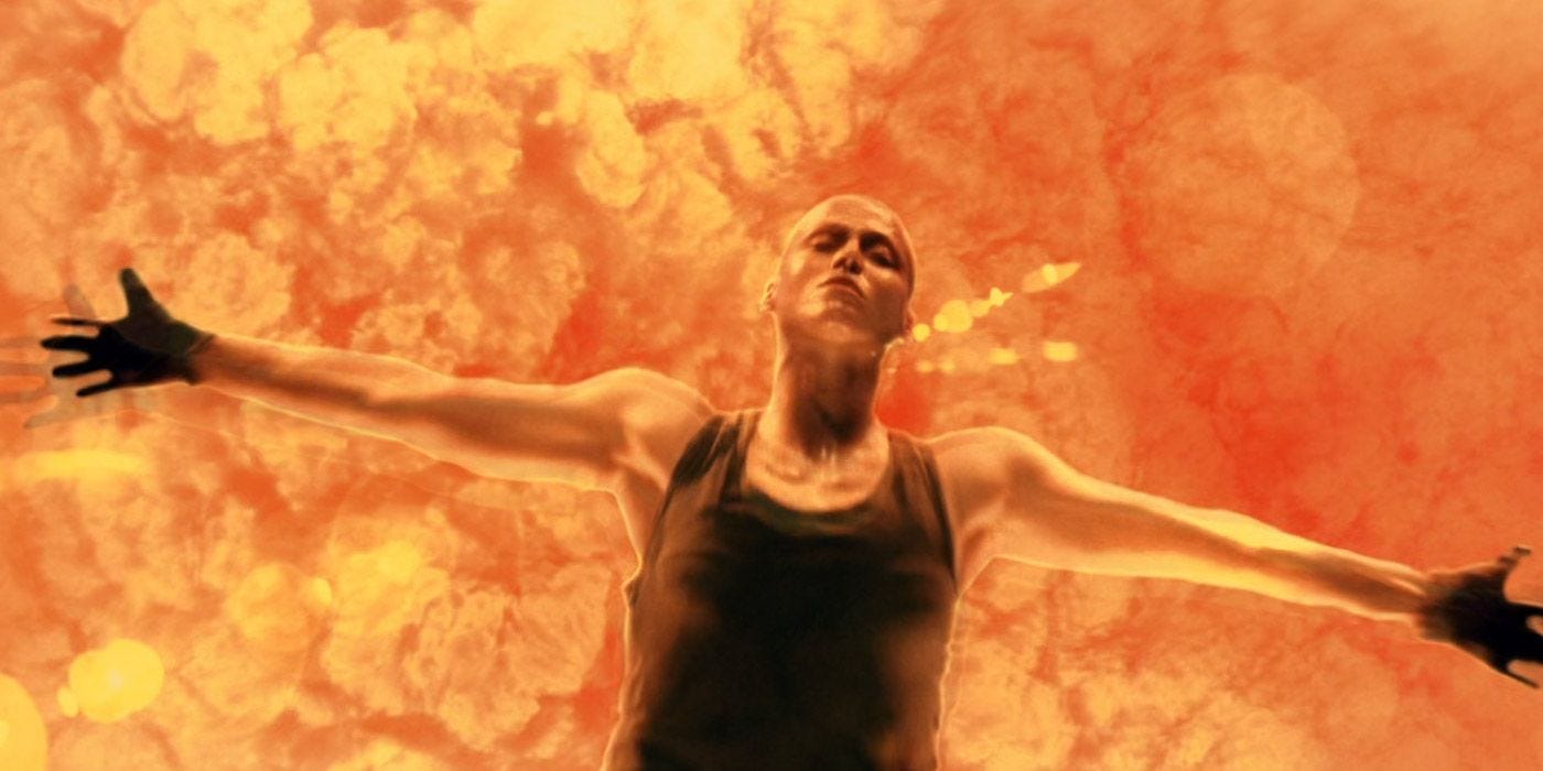 Movie still from Alien: Resurrection. Ripley falls into a fiery death, arms outstretched like Jesus.