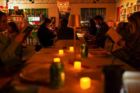 A grid of 9 images of Silent Book Club chapters reading Vigil by George Saunders 