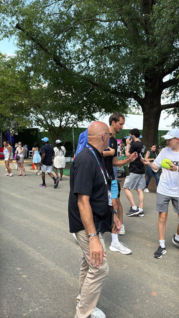 Daniil Medvedev and Leylah Fernandez signing autographs and taking selfies