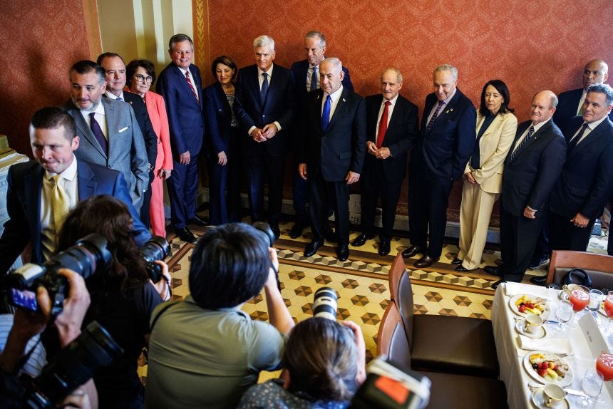 Prime Minister of Israel Benjamin Netanyahu, center, meets with a bipartisan group of lawmakers including Sen. Cory Booker, right, on July 9, 2025, in Washington.