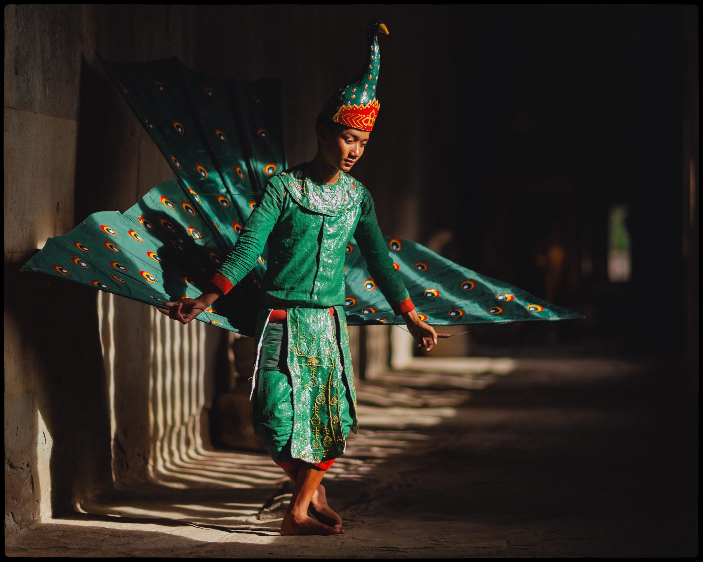 A traditional Khmer dancer wearing a peacock costume, Angkor Wat, Cambodia. 1/1000, ƒ/1.2, ISO 100, 85mm. © Gavin Gough