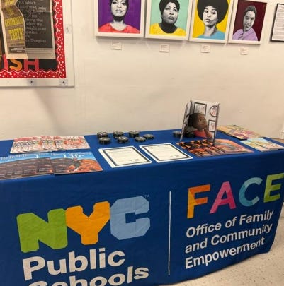 Picture of FACE table and staff at the event