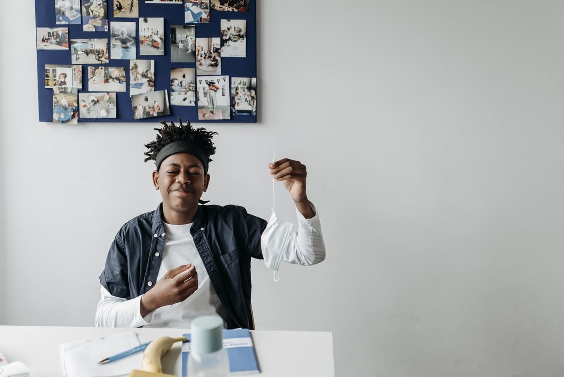 A Boy Sitting at the Table