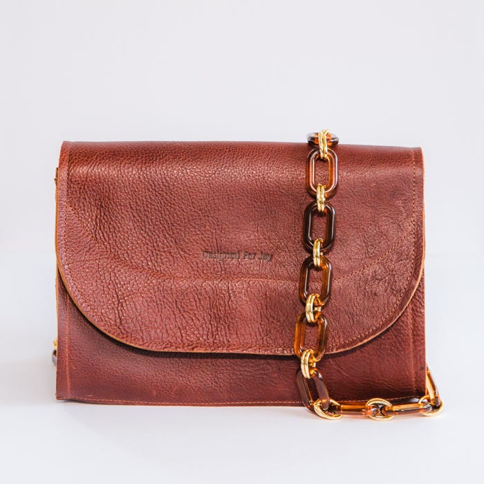 Made from scratch-resistant, full-grain U.S. cowhide leather with a soft pebbled texture, the Dorothy is tanned in Mexico.