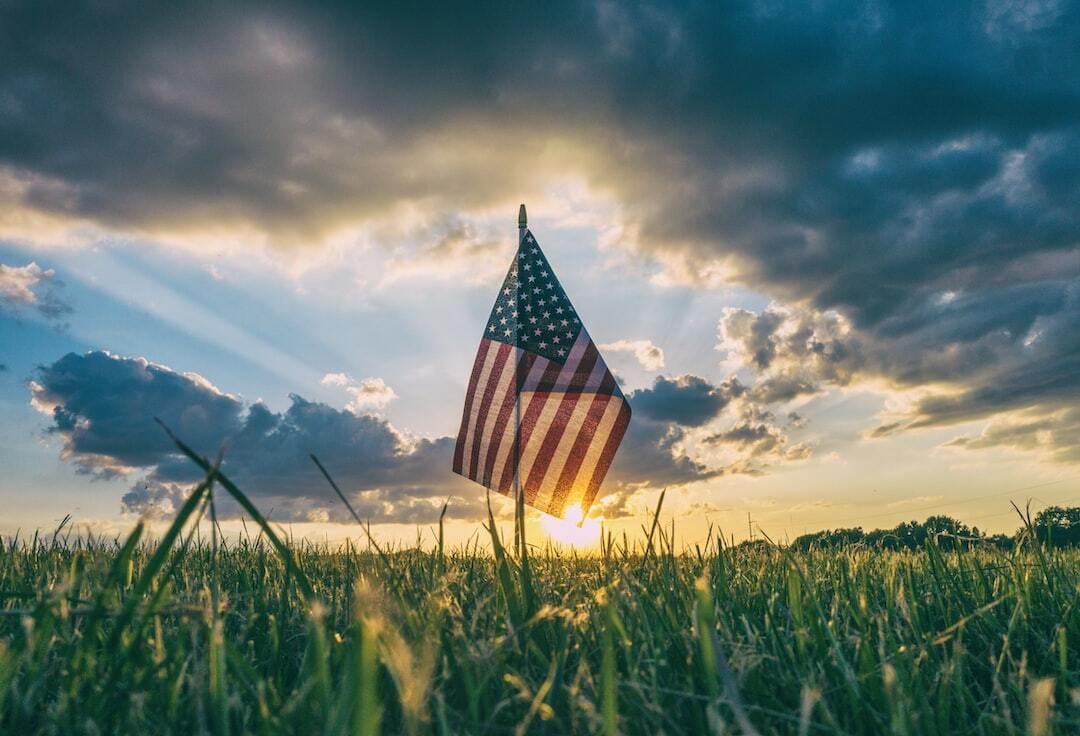 flag of USA on grass field flag of USA on grass field