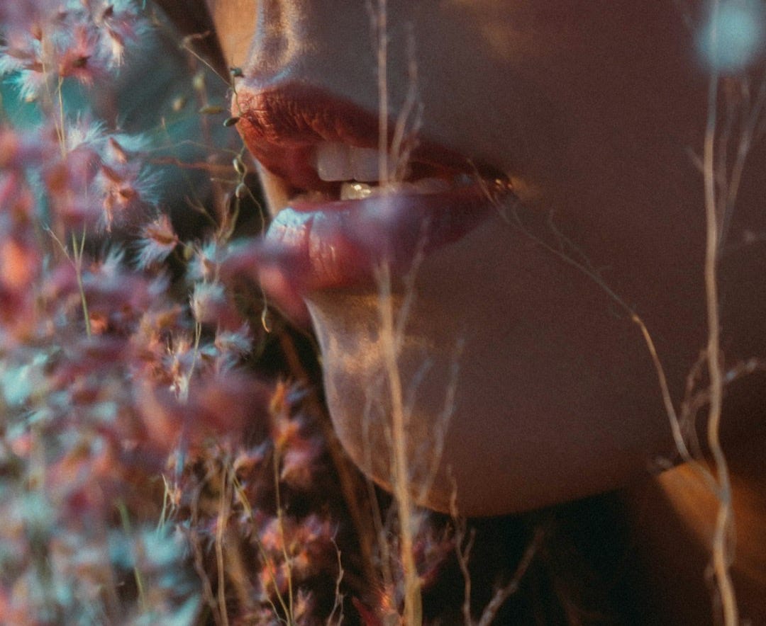 a close-up of a person holding a plant a close-up of a person holding a plant