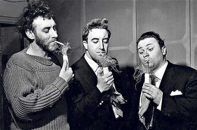A picture of the three Goons trying to light cigarettes using parsnips.