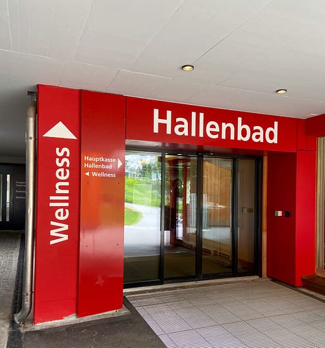Lower entrance to the conference center where the World Economic Forum takes place, selfie in front of said entrance, entrance to Hallenbad