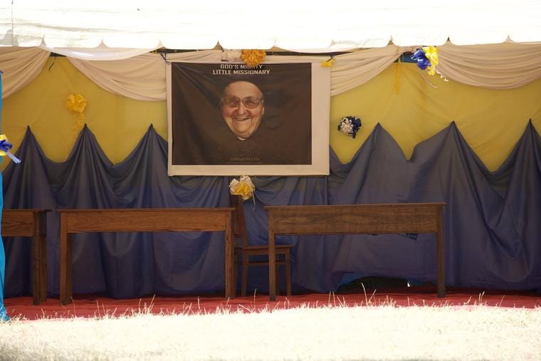 A banner of the book cover of ‘God’s Mighty Little Missionary’ by Edward Pentin hangs in Puma, Tanzania, for the 50th-jubilee celebrations of the order Mother Maria Stieren founded.