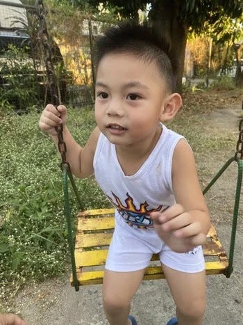 Rafa enjoying the swing in a local park Rafa enjoying the swing in a local park