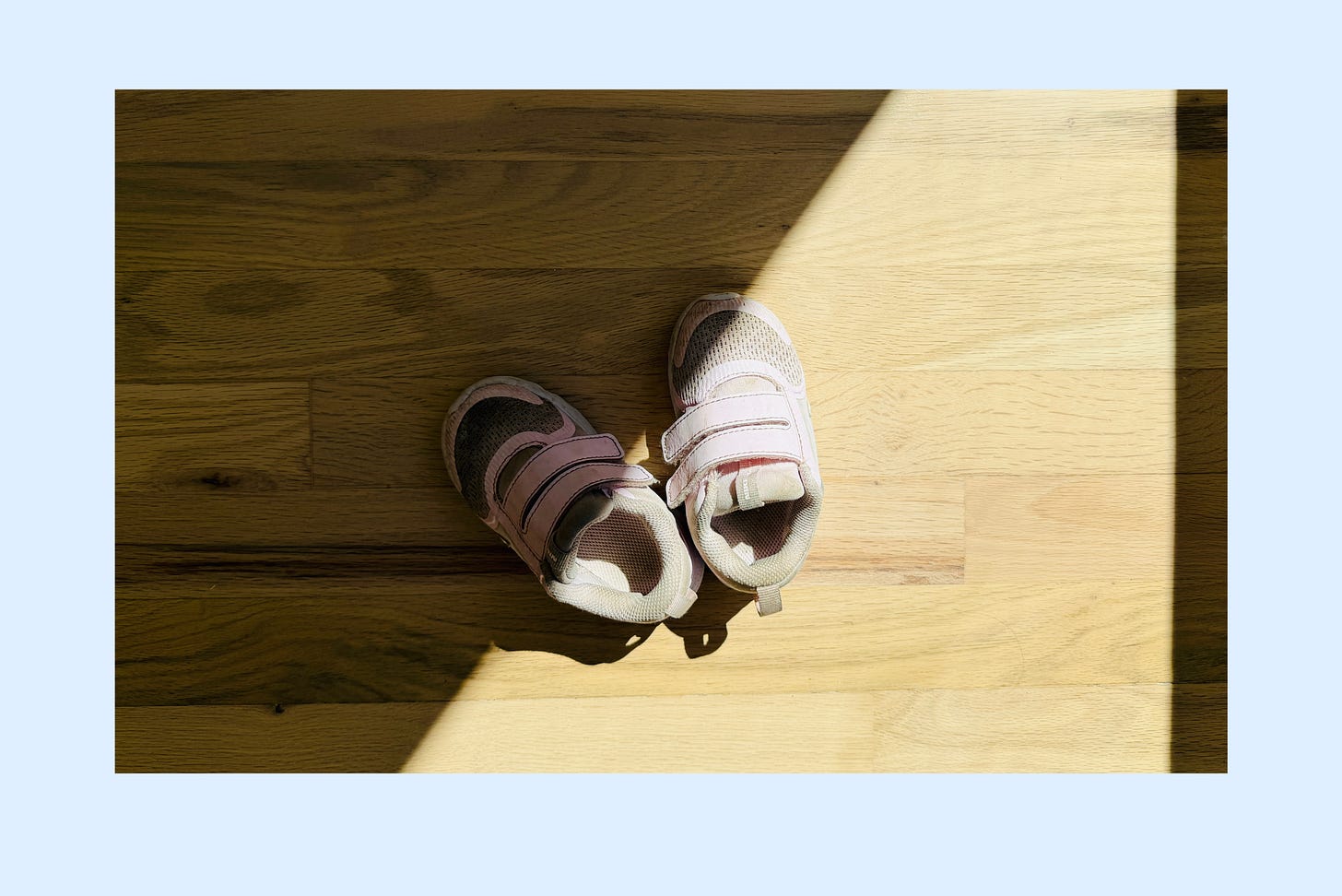 A brand new pair of small shoes on a two-year-old's feet, shot straight down from standing height A brand new pair of small shoes on a two-year-old's feet, shot straight down from standing height