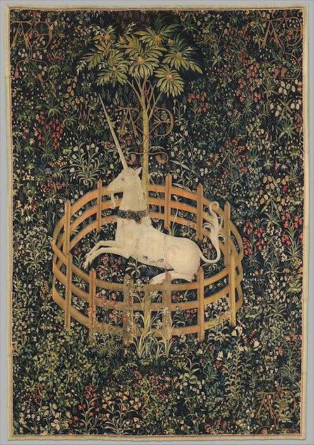 Tapestry with a unicorn inside a fence, surrounded by flowers and greenery