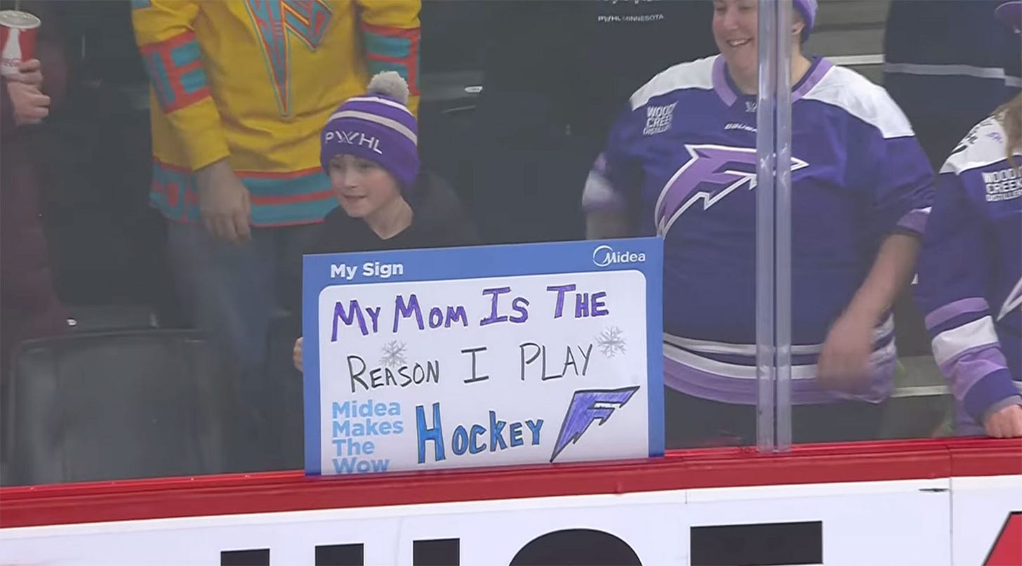 Sign: "My mom is the reason I play hockey."