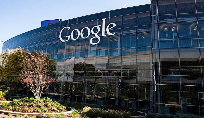 Photo of the exterior of Google headquarters, a glass fronted building with the Google logo Photo of the exterior of Google headquarters, a glass fronted building with the Google logo