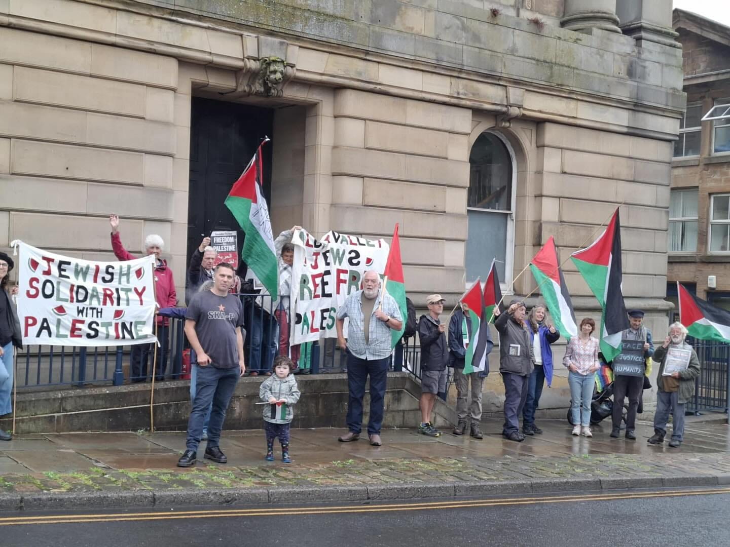 May be an image of 13 people and text that says 'EMEETON FREEDOM TEWISH SOLIDARITY ARITY SOLID WITH PALESTINE INE VALLET JEWS REEFR PALEST SKIP 카00 JuSTIc HUMKITY' May be an image of 13 people and text that says 'EMEETON FREEDOM TEWISH SOLIDARITY ARITY SOLID WITH PALESTINE INE VALLET JEWS REEFR PALEST SKIP 카00 JuSTIc HUMKITY'