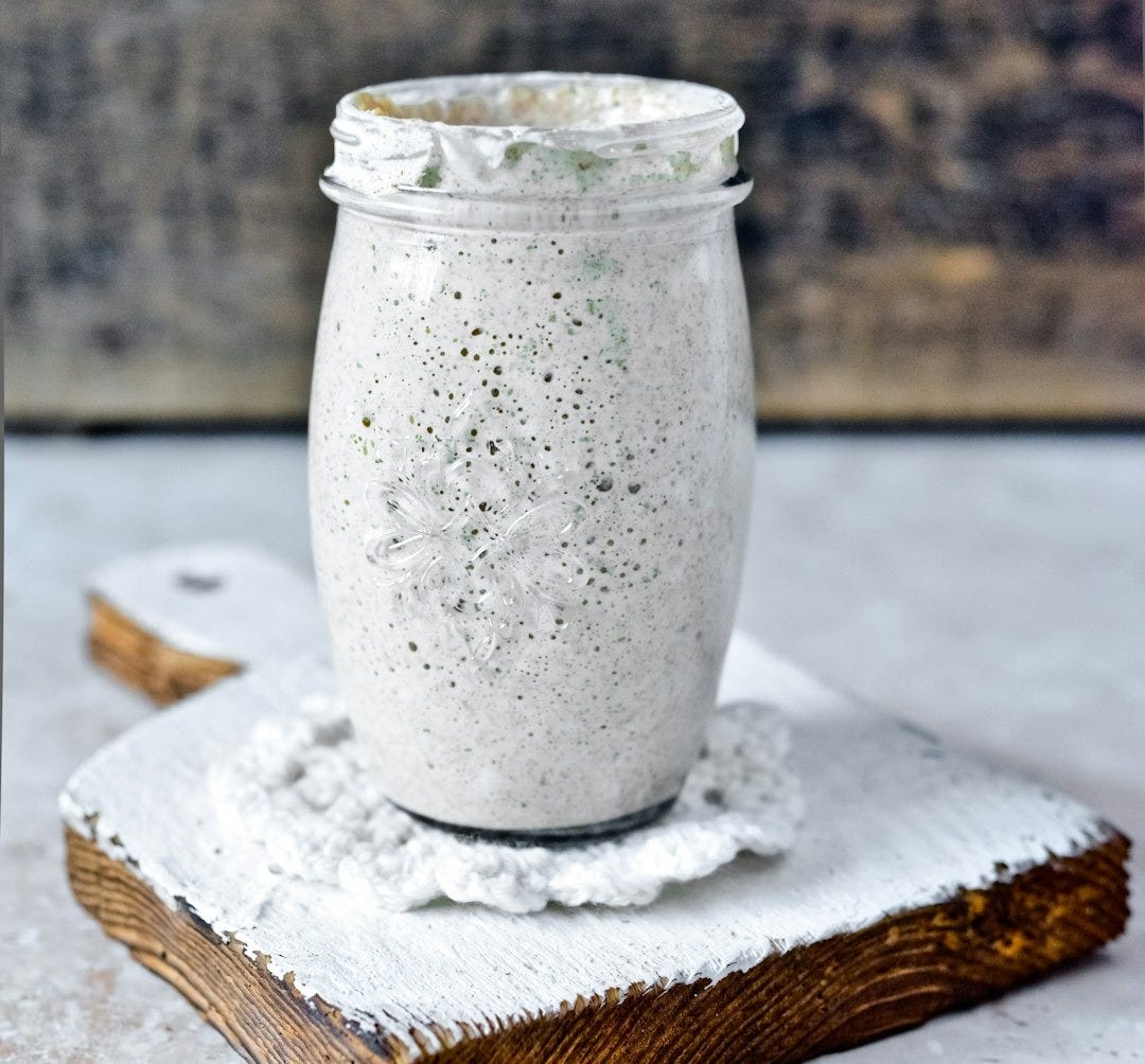 clear glass jar on white wooden table