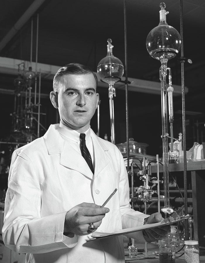 Black And White Photograph - 1960s Man Scientist In Chemistry by Vintage Images Black And White Photograph - 1960s Man Scientist In Chemistry by Vintage Images