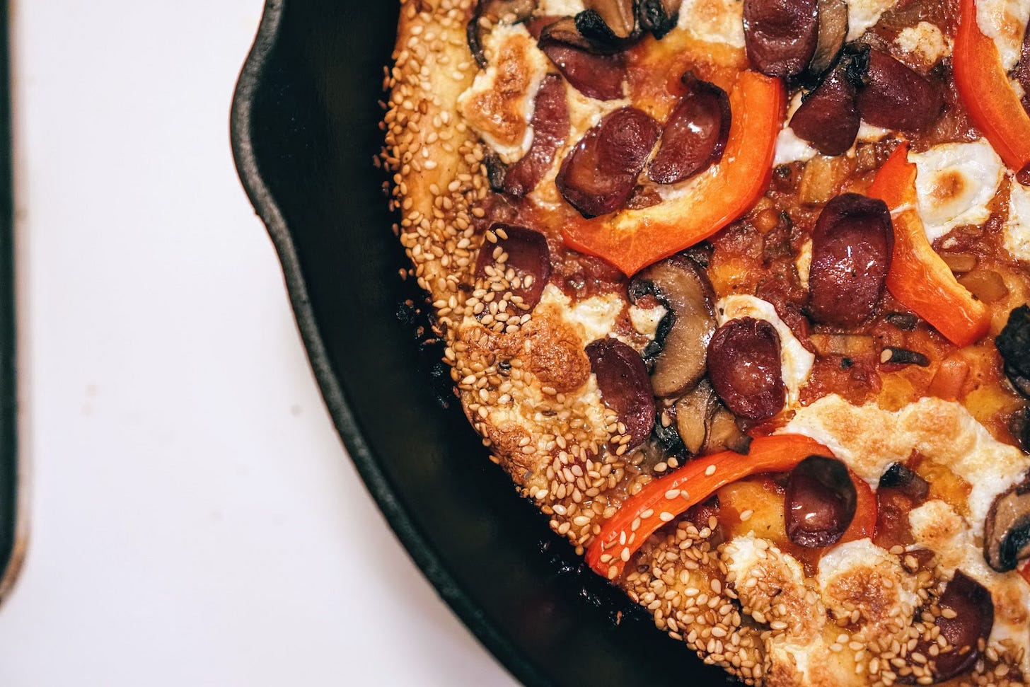 A closeup of hot dog pizza 