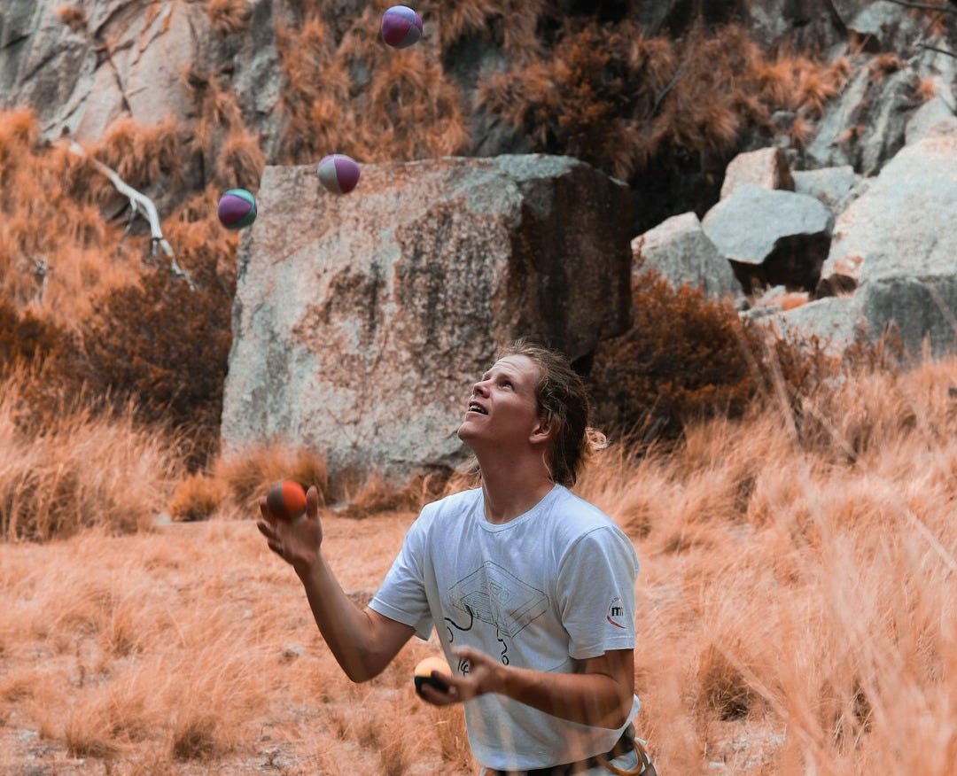 a man in a field with a frisbee a man in a field with a frisbee