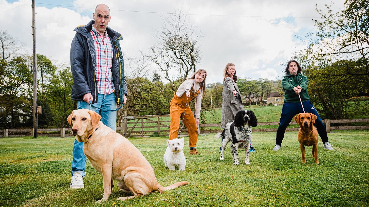 The cast of Mikron Theatre's A Dog's Tale struggle to control lively pooches. The cast of Mikron Theatre's A Dog's Tale struggle to control lively pooches.