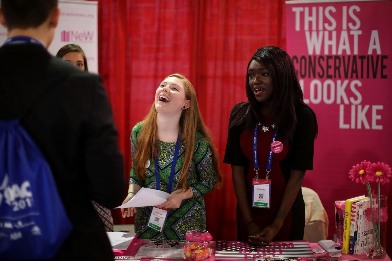 Young women at the Network of Enlightened Women table during the Conservative Political Action Conference on Feb. 23, 2017. Young women at the Network of Enlightened Women table during the Conservative Political Action Conference on Feb. 23, 2017.