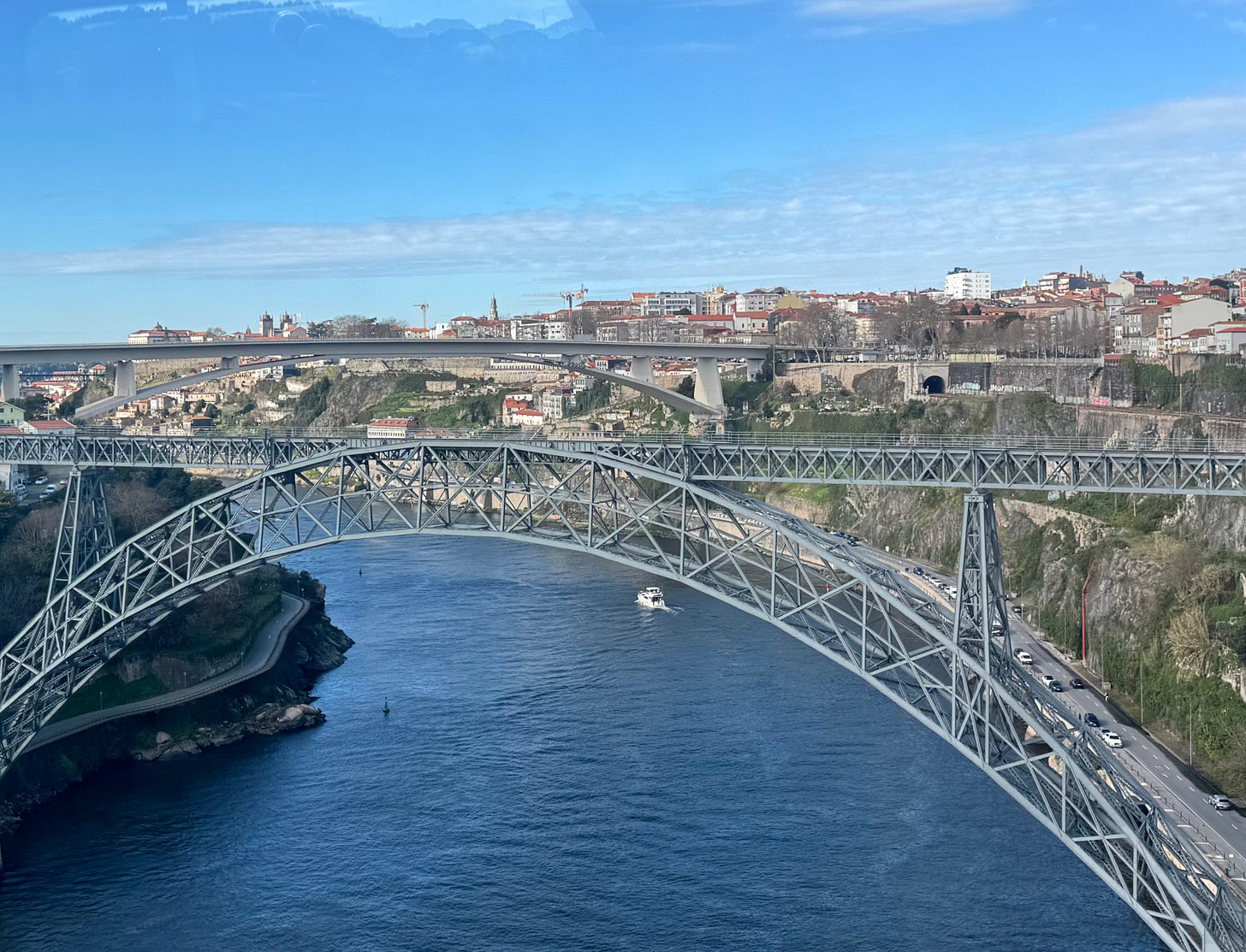 Two dramatic bridges over a winding river and a city on its steep banks. Two dramatic bridges over a winding river and a city on its steep banks.