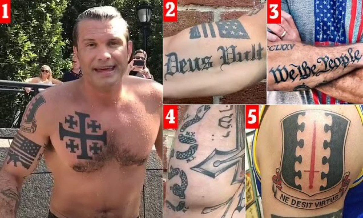 A shirtless man with multiple tattoos on his torso and arms, including a cross on his chest, an American flag, and text reading "Deus Vult" and "We the People." Additional tattoos show symbols like a shield with vertical lines and a crest with Latin text "Ne Desit Virtus." Numbers 1 to 5 are visible, labeling different tattoo areas. A shirtless man with multiple tattoos on his torso and arms, including a cross on his chest, an American flag, and text reading "Deus Vult" and "We the People." Additional tattoos show symbols like a shield with vertical lines and a crest with Latin text "Ne Desit Virtus." Numbers 1 to 5 are visible, labeling different tattoo areas.