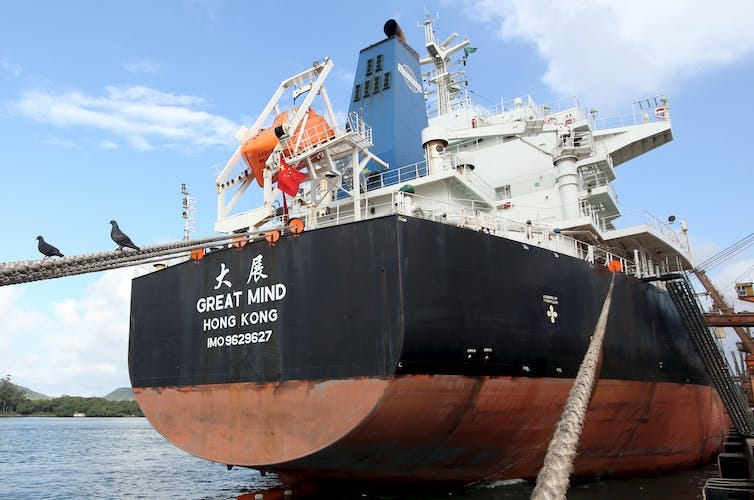 A ship being loaded at a Brazilian port.