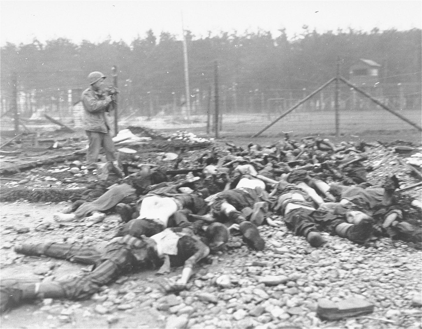 A U.S. Signal Corps cameraman, Joseph Wright of the 103rd Infantry Division, films evidence of ... A U.S. Signal Corps cameraman, Joseph Wright of the 103rd Infantry Division, films evidence of ...