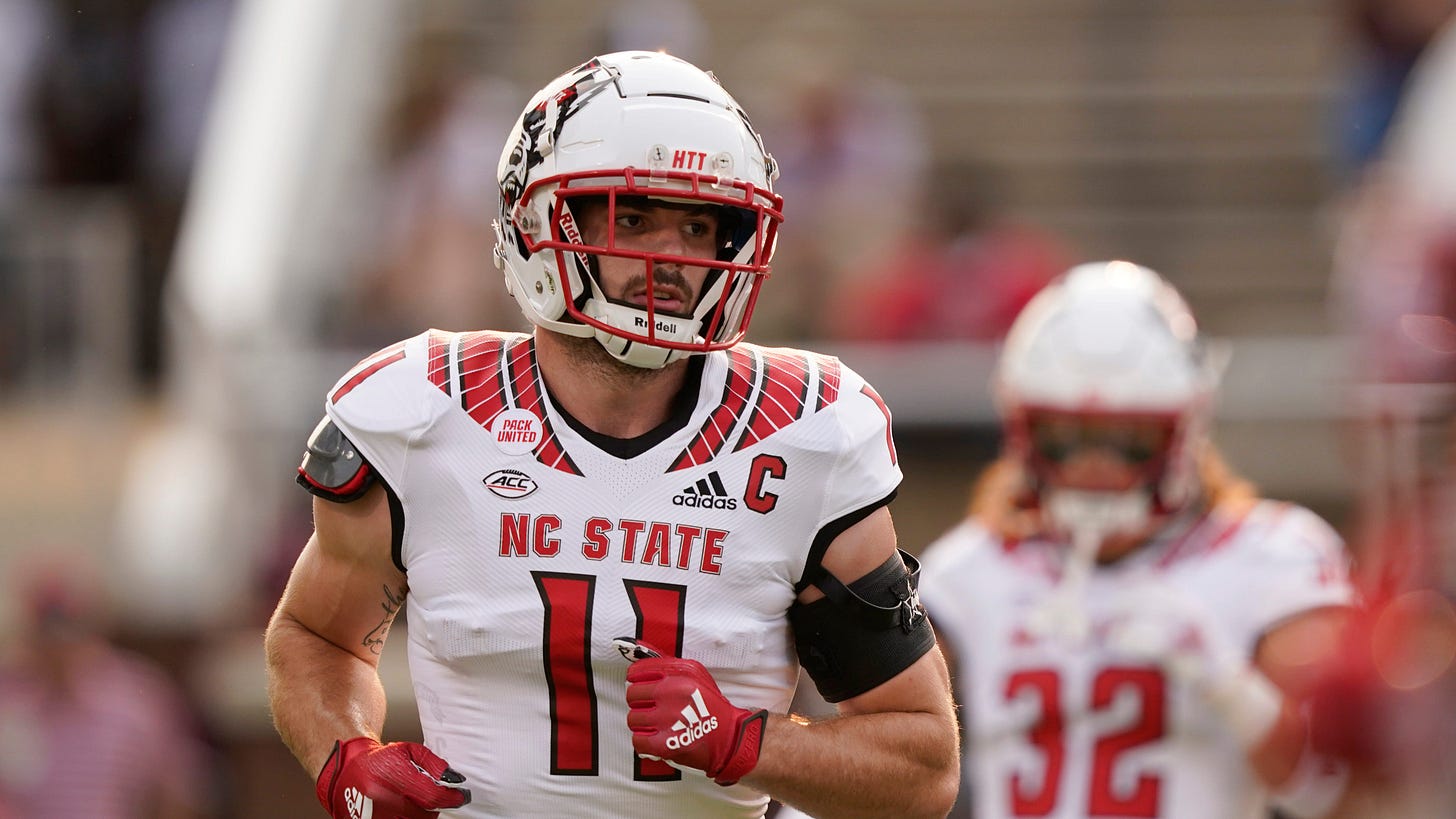 Payton Wilson cheers on the NC State's Wolfpack from the sidelines