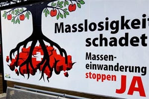 During Swiss vote on EU immigration. An electoral poster in favor of a “stop mass immigration” referendum During Swiss vote on EU immigration. An electoral poster in favor of a “stop mass immigration” referendum